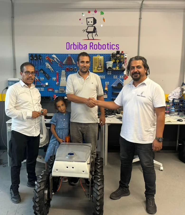 Orbiba Robotics team completing its first agricultural robot sale